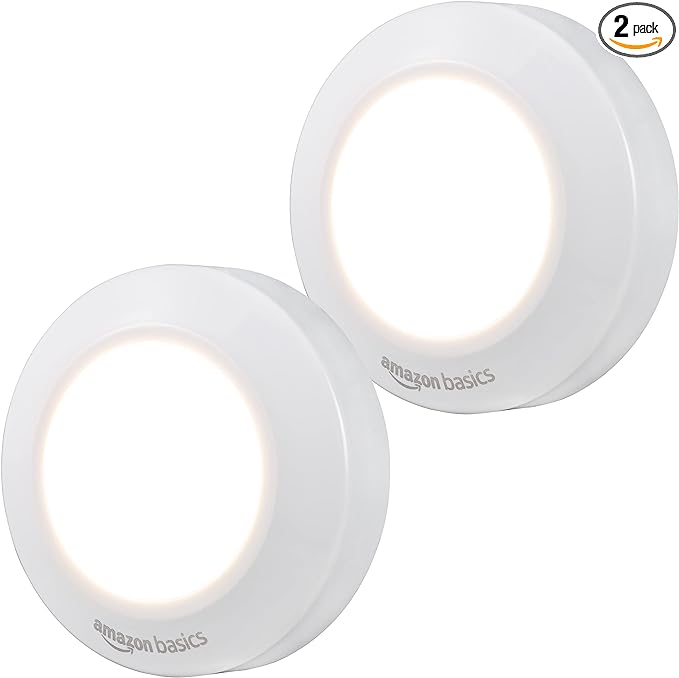 Amazon Basics LED Puck Lights, Battery Operated, 50 Lumens 2 Pack, Tap Light, Stick on Lights, Under Cabinet Lighting, Ideal for Kitchen Cabinets, Closets, Garage and More, White